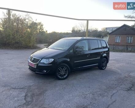 Черный Фольксваген Туран, объемом двигателя 1.4 л и пробегом 238 тыс. км за 7888 $, фото 113 на Automoto.ua