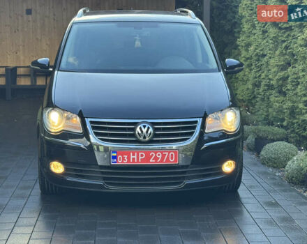 Черный Фольксваген Туран, объемом двигателя 1.4 л и пробегом 199 тыс. км за 7999 $, фото 1 на Automoto.ua