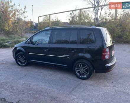 Черный Фольксваген Туран, объемом двигателя 1.4 л и пробегом 238 тыс. км за 7888 $, фото 115 на Automoto.ua