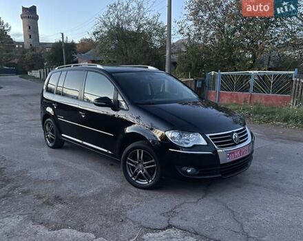 Черный Фольксваген Туран, объемом двигателя 1.4 л и пробегом 238 тыс. км за 7888 $, фото 2 на Automoto.ua