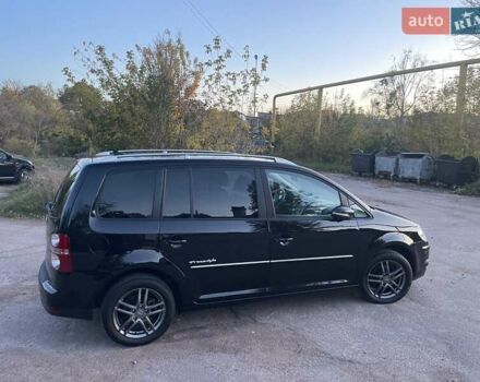 Черный Фольксваген Туран, объемом двигателя 1.4 л и пробегом 238 тыс. км за 7888 $, фото 103 на Automoto.ua