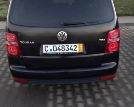 Черный Фольксваген Туран, объемом двигателя 1.9 л и пробегом 180 тыс. км за 11669 $, фото 1 на Automoto.ua