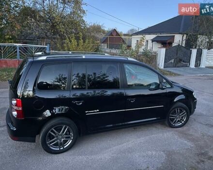 Черный Фольксваген Туран, объемом двигателя 1.4 л и пробегом 238 тыс. км за 7888 $, фото 6 на Automoto.ua