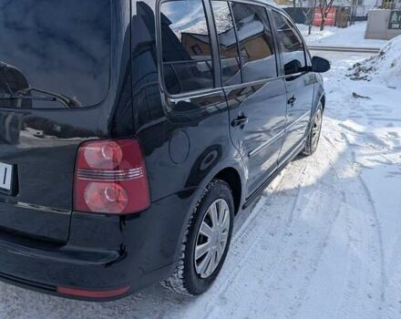 Черный Фольксваген Туран, объемом двигателя 2 л и пробегом 236 тыс. км за 9800 $, фото 1 на Automoto.ua