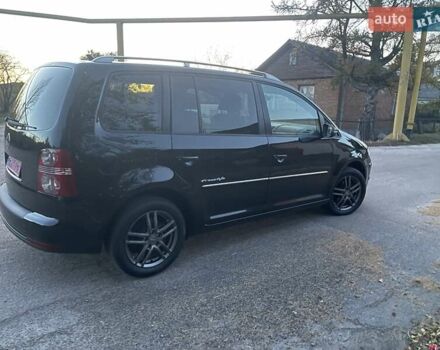 Черный Фольксваген Туран, объемом двигателя 1.4 л и пробегом 238 тыс. км за 7888 $, фото 222 на Automoto.ua