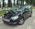 Черный Фольксваген Туран, объемом двигателя 1.4 л и пробегом 248 тыс. км за 7399 $, фото 1 на Automoto.ua
