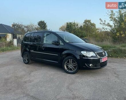 Черный Фольксваген Туран, объемом двигателя 1.4 л и пробегом 238 тыс. км за 7888 $, фото 91 на Automoto.ua