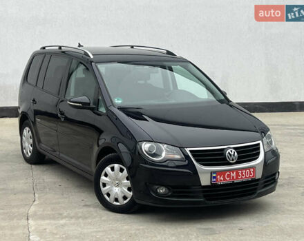 Черный Фольксваген Туран, объемом двигателя 1.4 л и пробегом 213 тыс. км за 8100 $, фото 1 на Automoto.ua