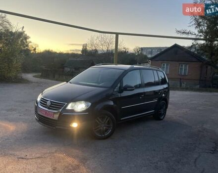 Черный Фольксваген Туран, объемом двигателя 1.4 л и пробегом 238 тыс. км за 7888 $, фото 106 на Automoto.ua