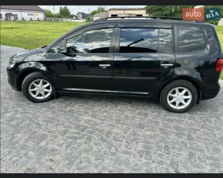 Черный Фольксваген Туран, объемом двигателя 1.4 л и пробегом 223 тыс. км за 7900 $, фото 1 на Automoto.ua