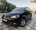 Черный Фольксваген Туран, объемом двигателя 1.4 л и пробегом 174 тыс. км за 9350 $, фото 1 на Automoto.ua