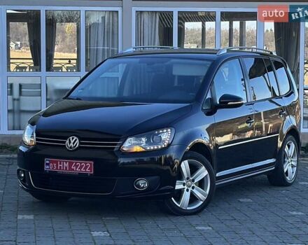 Черный Фольксваген Туран, объемом двигателя 2 л и пробегом 200 тыс. км за 12250 $, фото 1 на Automoto.ua