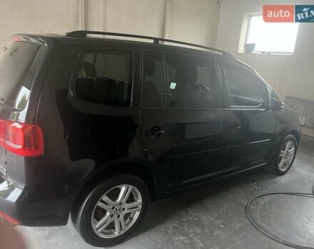 Черный Фольксваген Туран, объемом двигателя 1.97 л и пробегом 299 тыс. км за 11200 $, фото 1 на Automoto.ua