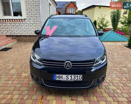 Черный Фольксваген Туран, объемом двигателя 1.6 л и пробегом 204 тыс. км за 11950 $, фото 1 на Automoto.ua