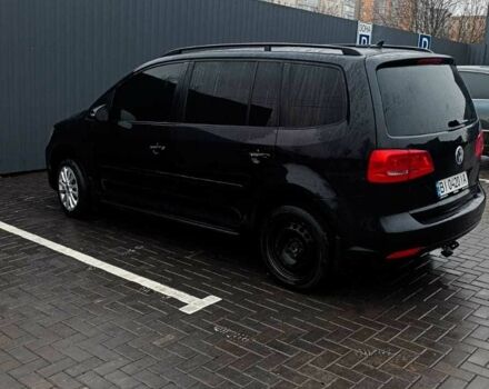 Черный Фольксваген Туран, объемом двигателя 1.4 л и пробегом 200 тыс. км за 10500 $, фото 1 на Automoto.ua