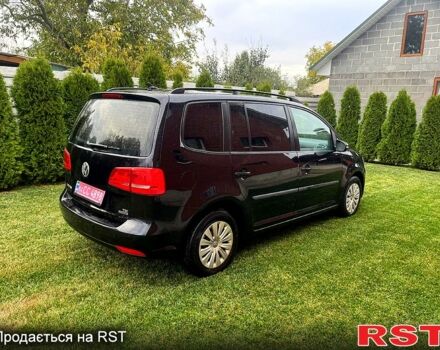 Черный Фольксваген Туран, объемом двигателя 1.6 л и пробегом 248 тыс. км за 9800 $, фото 1 на Automoto.ua