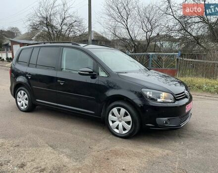 Черный Фольксваген Туран, объемом двигателя 1.4 л и пробегом 207 тыс. км за 10777 $, фото 1 на Automoto.ua