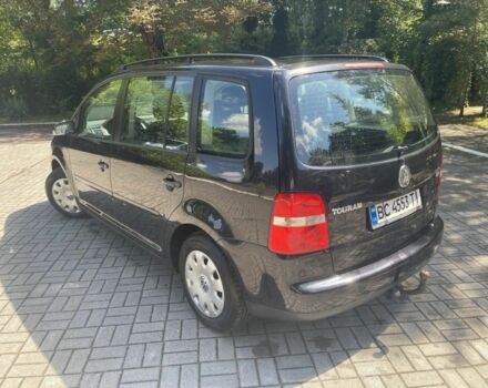 Черный Фольксваген Туран, объемом двигателя 1.6 л и пробегом 256 тыс. км за 4700 $, фото 1 на Automoto.ua