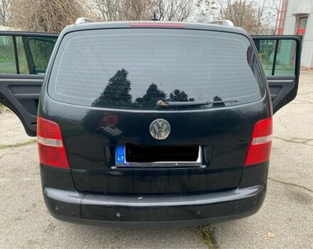 Чорний Фольксваген Туран, об'ємом двигуна 2 л та пробігом 383 тис. км за 3500 $, фото 1 на Automoto.ua