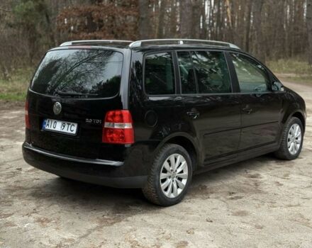 Чорний Фольксваген Туран, об'ємом двигуна 2 л та пробігом 328 тис. км за 2999 $, фото 4 на Automoto.ua