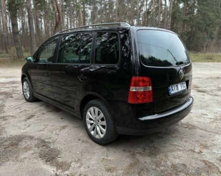 Чорний Фольксваген Туран, об'ємом двигуна 2 л та пробігом 328 тис. км за 2999 $, фото 6 на Automoto.ua