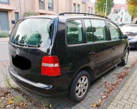 Черный Фольксваген Туран, объемом двигателя 1.6 л и пробегом 200 тыс. км за 4850 $, фото 1 на Automoto.ua