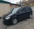 Черный Фольксваген Туран, объемом двигателя 1.9 л и пробегом 242 тыс. км за 8500 $, фото 1 на Automoto.ua