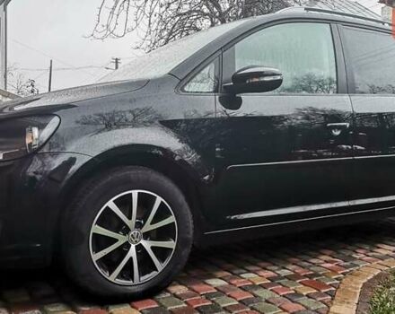 Черный Фольксваген Туран, объемом двигателя 1.6 л и пробегом 211 тыс. км за 12950 $, фото 1 на Automoto.ua