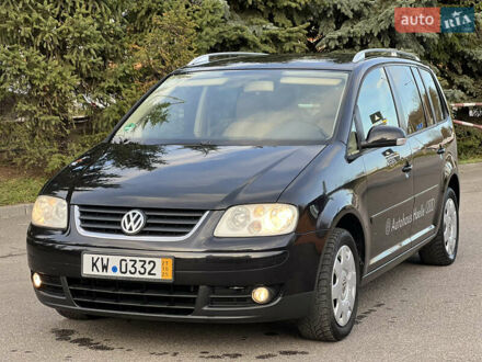 Черный Фольксваген Туран, объемом двигателя 1.6 л и пробегом 195 тыс. км за 5100 $, фото 1 на Automoto.ua