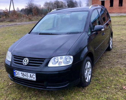 Черный Фольксваген Туран, объемом двигателя 1.97 л и пробегом 400 тыс. км за 4999 $, фото 1 на Automoto.ua