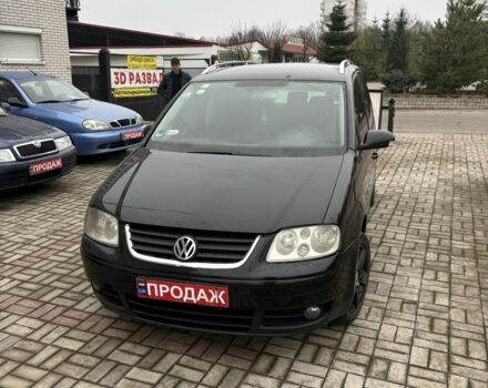 Черный Фольксваген Туран, объемом двигателя 2 л и пробегом 350 тыс. км за 2300 $, фото 1 на Automoto.ua