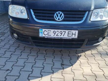 Черный Фольксваген Туран, объемом двигателя 1.6 л и пробегом 218 тыс. км за 5600 $, фото 1 на Automoto.ua