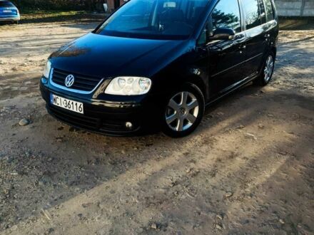 Черный Фольксваген Туран, объемом двигателя 2 л и пробегом 325 тыс. км за 3300 $, фото 1 на Automoto.ua