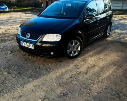 Черный Фольксваген Туран, объемом двигателя 2 л и пробегом 325 тыс. км за 3300 $, фото 1 на Automoto.ua