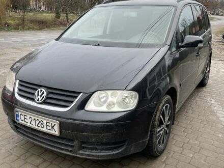 Черный Фольксваген Туран, объемом двигателя 1.6 л и пробегом 229 тыс. км за 4650 $, фото 1 на Automoto.ua