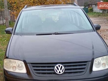 Черный Фольксваген Туран, объемом двигателя 1.6 л и пробегом 314 тыс. км за 5500 $, фото 1 на Automoto.ua