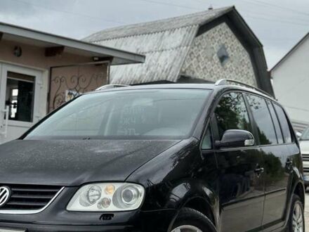 Черный Фольксваген Туран, объемом двигателя 1.98 л и пробегом 336 тыс. км за 5750 $, фото 1 на Automoto.ua