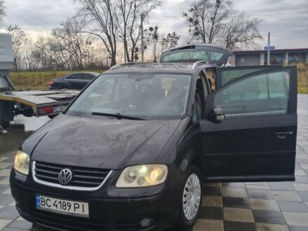 Черный Фольксваген Туран, объемом двигателя 2 л и пробегом 264 тыс. км за 6500 $, фото 1 на Automoto.ua