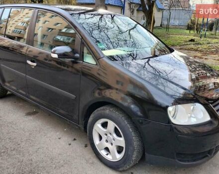 Черный Фольксваген Туран, объемом двигателя 1.6 л и пробегом 202 тыс. км за 5300 $, фото 1 на Automoto.ua