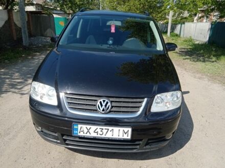 Фольксваген Туран 2004 в Изюме на Automoto.ua Черный Фольксваген Туран, объемом двигателя 1 л и пробегом 215 тыс. км за 5200 $, фото 1 на Automoto.ua