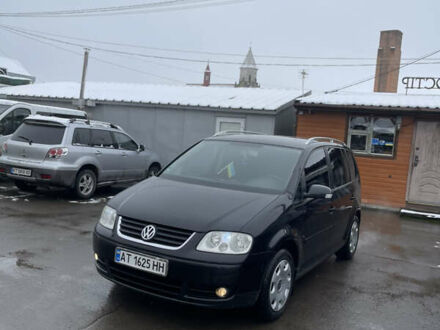 Черный Фольксваген Туран, объемом двигателя 1.6 л и пробегом 218 тыс. км за 5900 $, фото 1 на Automoto.ua