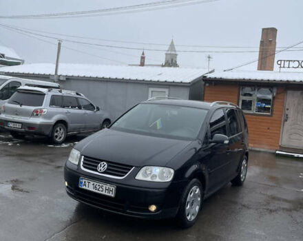 Черный Фольксваген Туран, объемом двигателя 1.6 л и пробегом 218 тыс. км за 5900 $, фото 1 на Automoto.ua