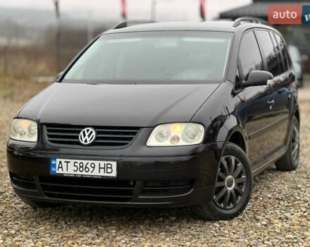 Черный Фольксваген Туран, объемом двигателя 1.6 л и пробегом 208 тыс. км за 5700 $, фото 1 на Automoto.ua