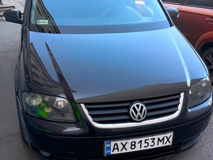 Черный Фольксваген Туран, объемом двигателя 2 л и пробегом 200 тыс. км за 5500 $, фото 1 на Automoto.ua