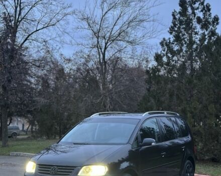 Черный Фольксваген Туран, объемом двигателя 2 л и пробегом 420 тыс. км за 3400 $, фото 1 на Automoto.ua