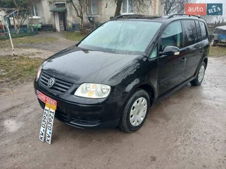 Черный Фольксваген Туран, объемом двигателя 1.6 л и пробегом 201 тыс. км за 4799 $, фото 1 на Automoto.ua