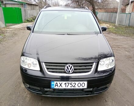 Черный Фольксваген Туран, объемом двигателя 1.6 л и пробегом 220 тыс. км за 6300 $, фото 1 на Automoto.ua