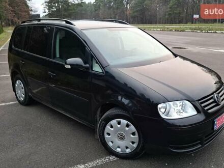 Черный Фольксваген Туран, объемом двигателя 1.6 л и пробегом 240 тыс. км за 5700 $, фото 1 на Automoto.ua
