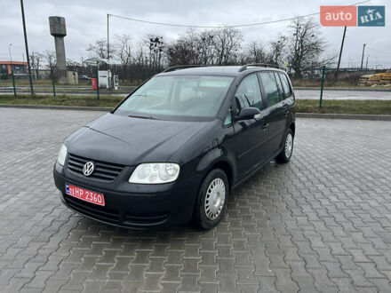 Черный Фольксваген Туран, объемом двигателя 1.6 л и пробегом 213 тыс. км за 5500 $, фото 1 на Automoto.ua