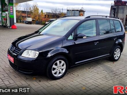 Черный Фольксваген Туран, объемом двигателя 1.6 л и пробегом 186 тыс. км за 6950 $, фото 1 на Automoto.ua